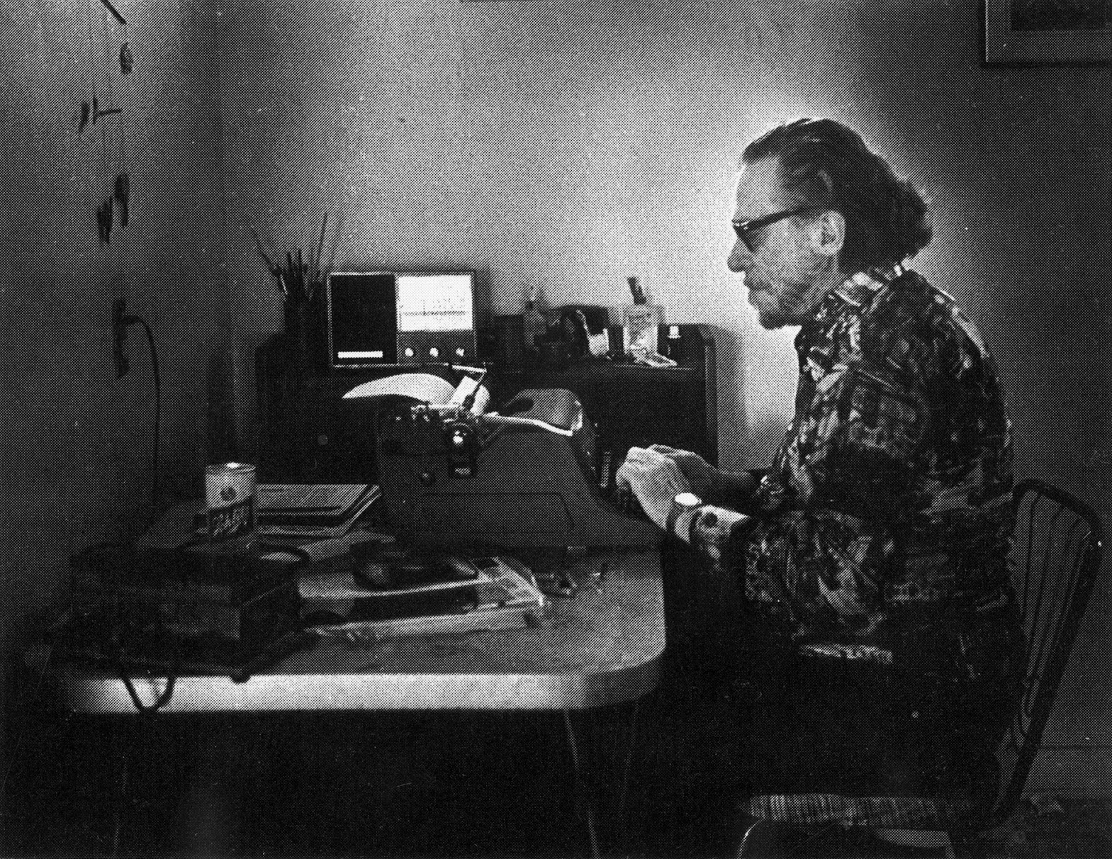 Postcard featuring Charles Bukowski at his typewriter in 1988. Photo by Joan Levine Gannij, published by Island International Bookstore, Amsterdam. Courtesy of the Huntington Library, Art Collections and Botanical Gardens. (HAND IN PHOTO 9-29-10)