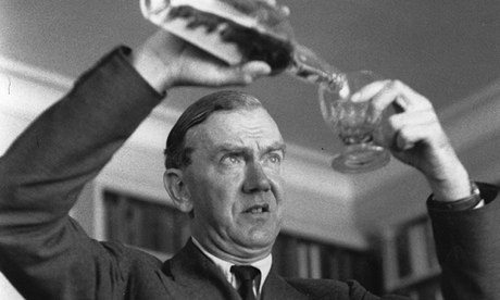 Graham Greene pours a drink